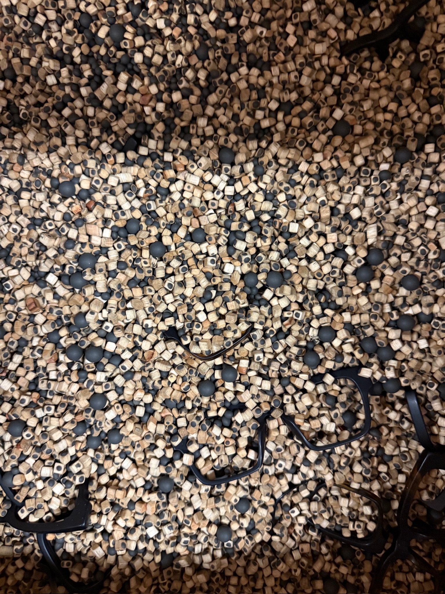 Cubo Eyewear acetate frames undergoing the tumbling and polishing process in an Italian eyewear factory