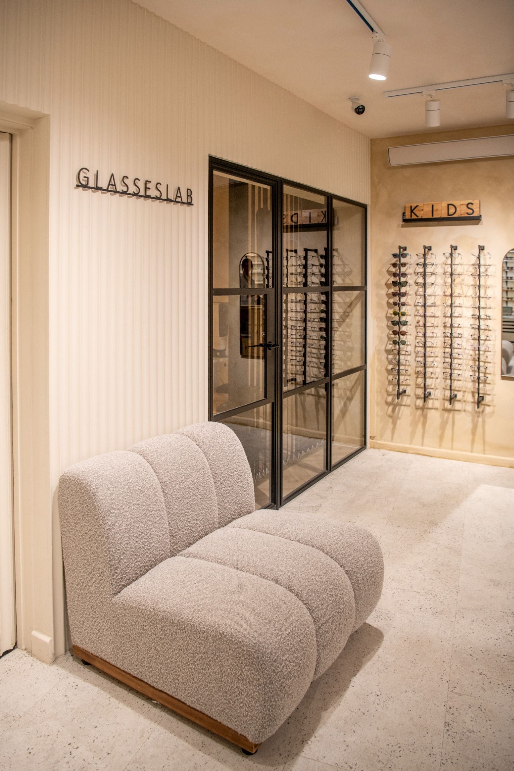 Glasseslab Beckenham opticians interior showing waiting area and eyewear displays