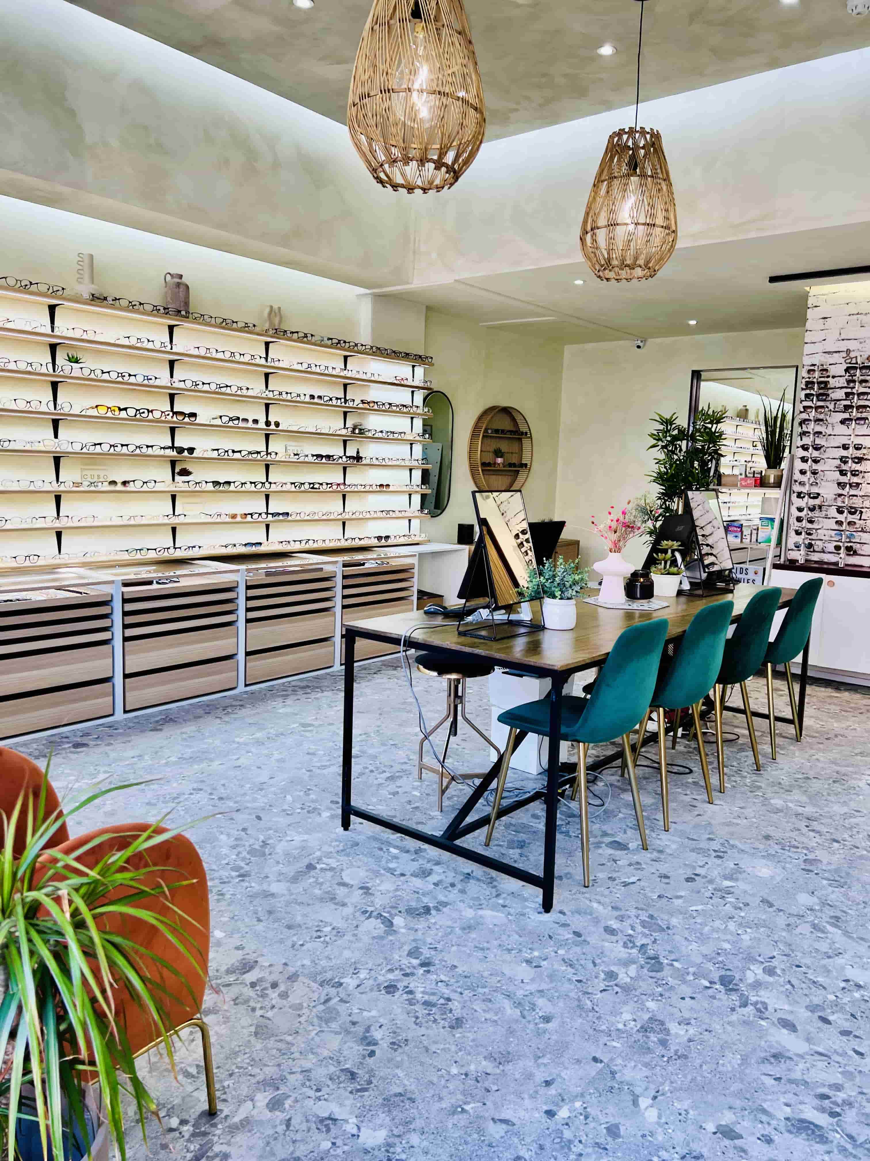 Interior of Glasseslab Bromley opticians featuring eyewear displays, consultation table and modern store design