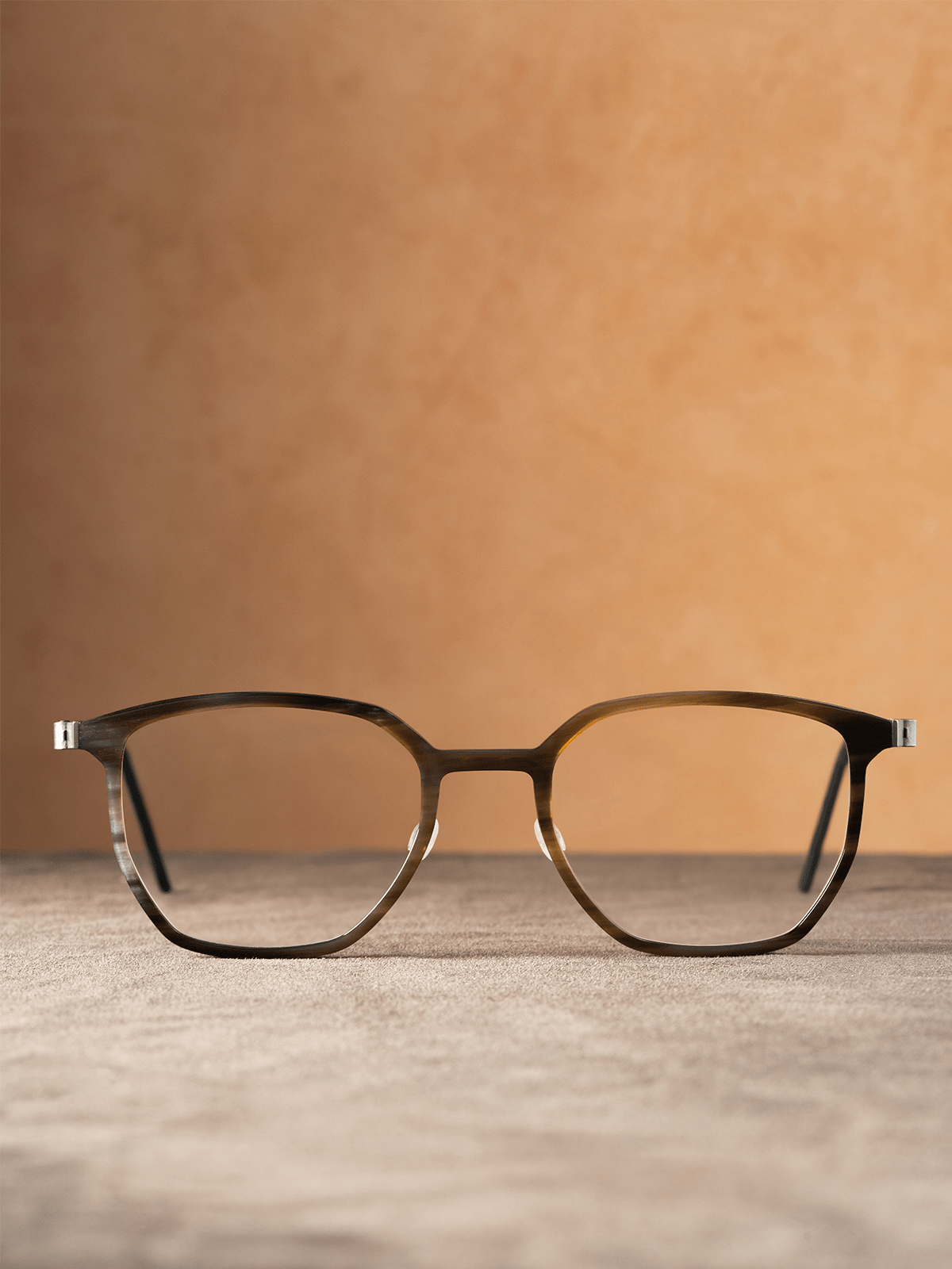 LINDBERG Buffalo Horn Titanium eyeglasses shown in a studio product shot, highlighting the lightweight titanium construction and natural horn-inspired front